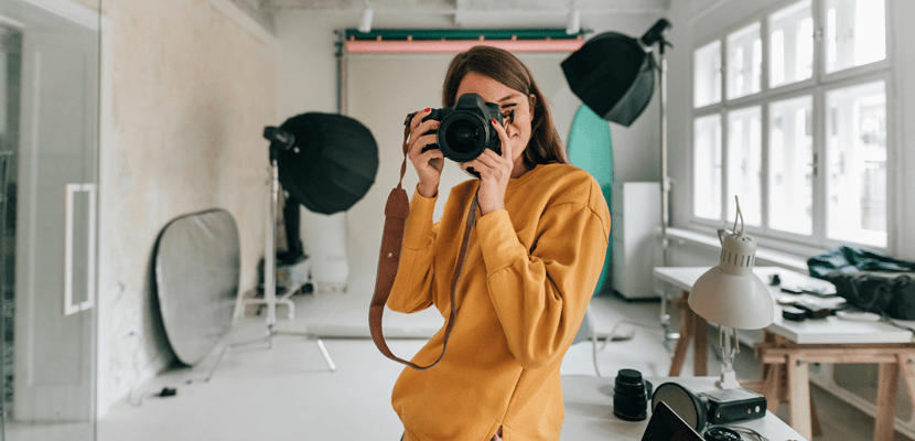 Lady taking a photo -loanhere