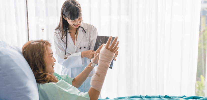 Doctor showing x-ray to the patient