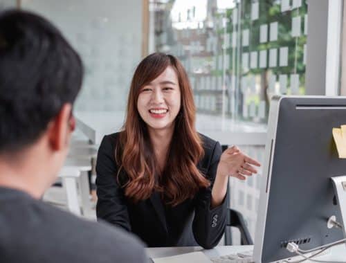Borrower in discussion with a legal money lender in an office in Singapore